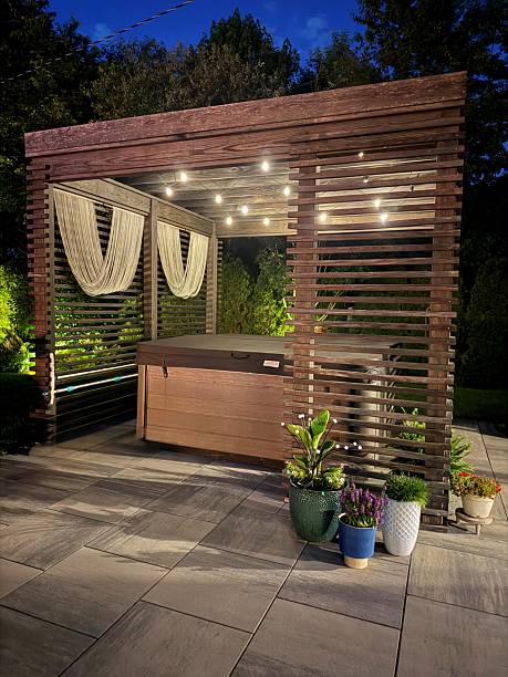 istock Gorgeous, luxury modern boho backyard design showcasing an outdoor pergola made from pine at sunset with a hot tub. 2222148196