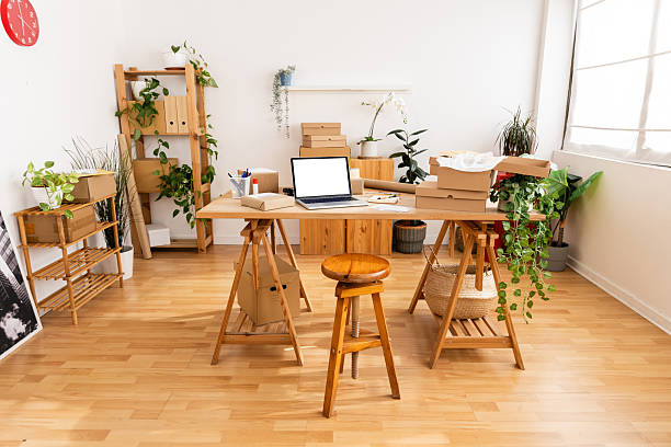 istock Startup business home office with laptop and cardboard boxes 2222150349