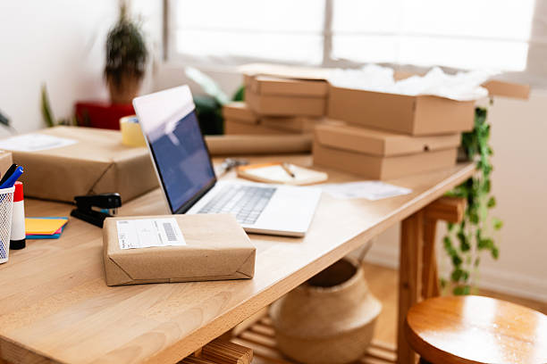 Entrepreneur workplace: cardboard boxes at a desk in a home office