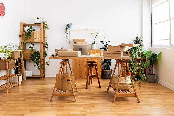 Small business sustainable workspace surrounded by plants and natural light,