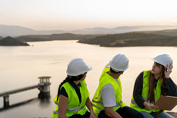 istock Engineers inspecting a reservoir at sunset 2222151522