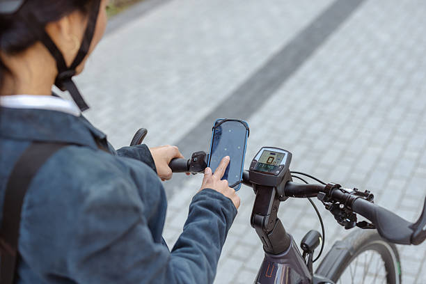 istock Person navigates smartphone interface while riding an advanced electric bicycle 2222153153