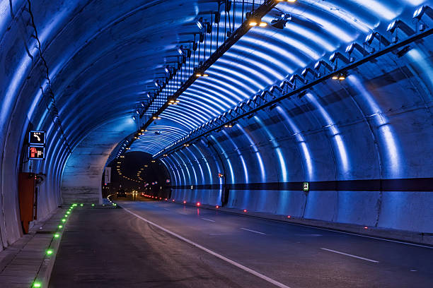 istock Illuminated modern roadway tunnel interior. 2222154947