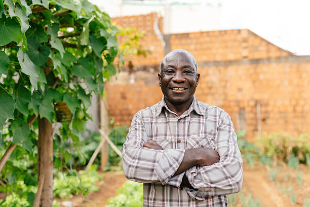 istock Elderly man standing proudly in home vegetable garden 2222159624