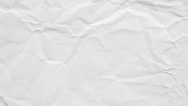 istock Abstract white crumpled and creased recycle paper texture background 2222168921