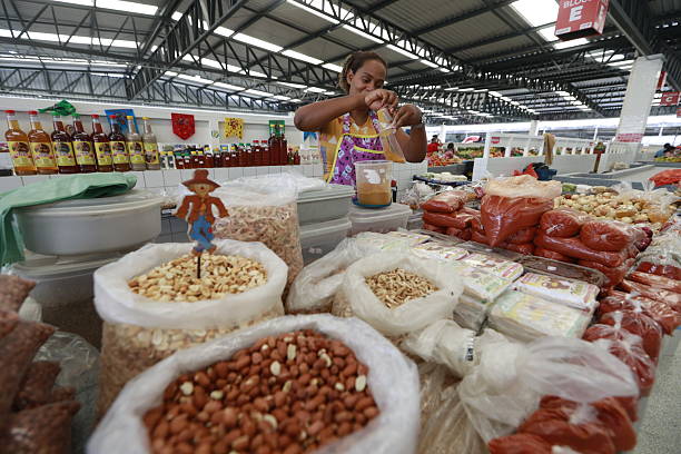 jequie, bahia, brazil - june 13, 2025: view of a municipal market stall selling fruits, vegetables, legumes and greens.