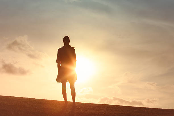 istock Woman at a sunset. 2222172066