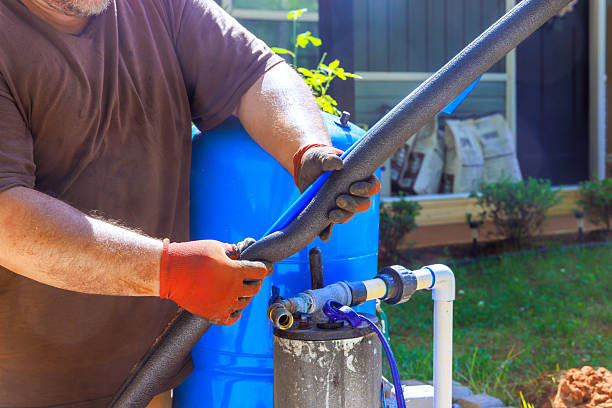 istock Hands work diligently on garden irrigation system in backyard during works day 2222173769