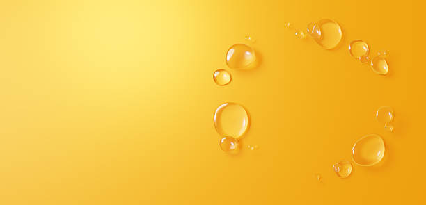 istock 3D Illustration.Background image of multiple water droplets on yellow background. Copy space. (Horizontal) 2222176152