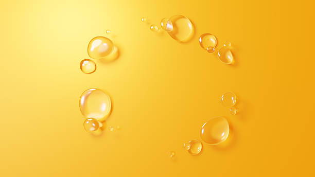 istock 3D Illustration.Background image of multiple water droplets on yellow background. (Horizontal) 2222176317