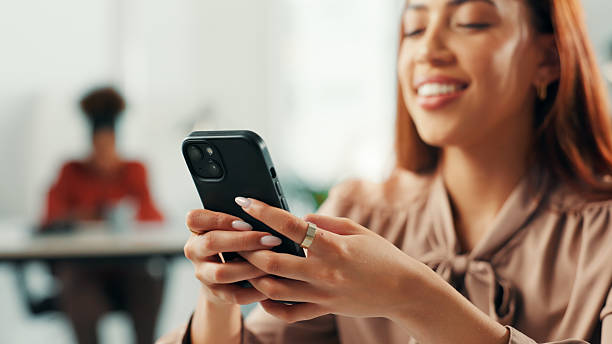 istock Business woman, hands or typing with phone in office for text message, email response or reading online news. Professional, employee and smartphone for app download, check notifications or web scroll 2222182235