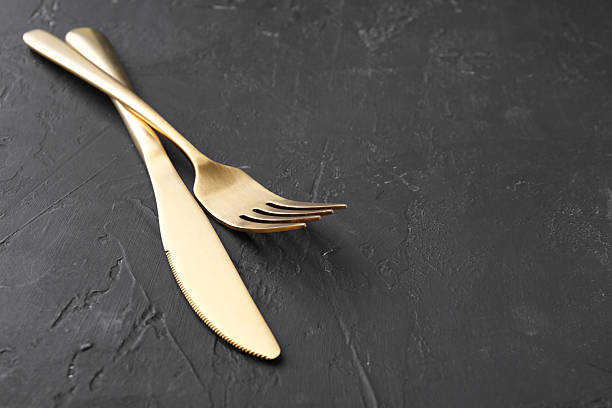 istock Beautiful cutlery set on black table. Space for text 2222182953