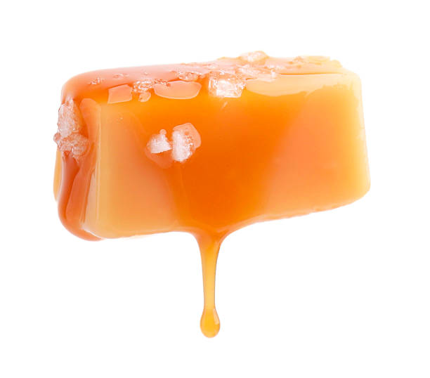 istock Yummy candy with salted caramel isolated on white 2222183115