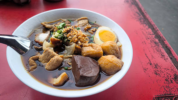 istock Thick noodle soup (Kuay Jap) with crispy pork, boiled egg, and beef, a delicious Thai food 2222183951