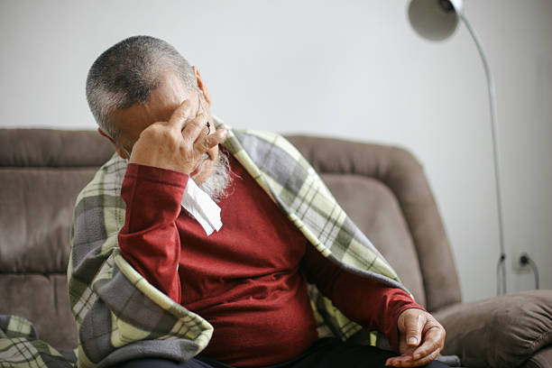 istock Sick Old Man Having  Fever 2222184046