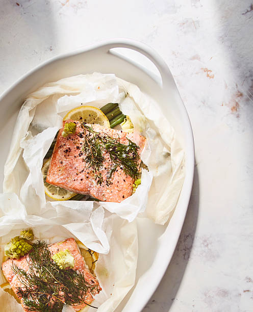 Fresh salmon fillet with herbs, lemon, and sea salt