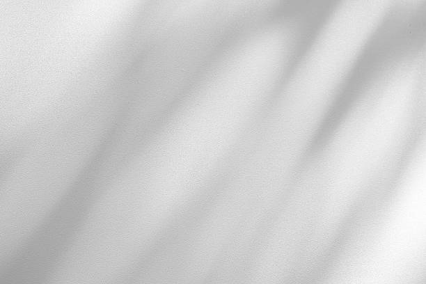 istock Wall interior background, studio and backdrops show products.with shadow from window color white . background for text insertion and presentation product 2222188230