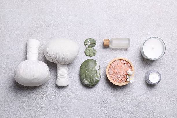 istock Flat lay composition with herbal massage bags and spa products on light grey table 2222188765