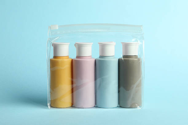 istock Cosmetic travel kit in plastic bag on light blue background 2222188772