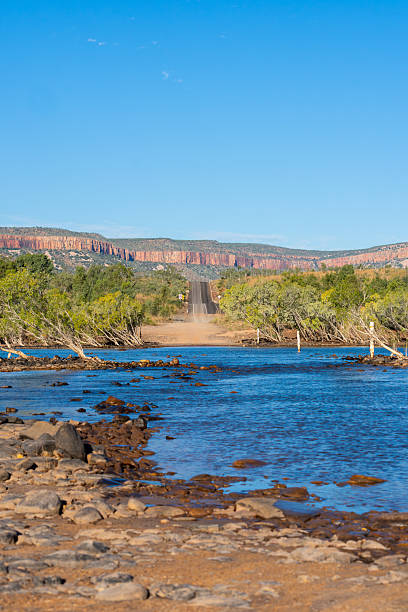 Scenic Penticost River roack edgees and flowing water under blue sky