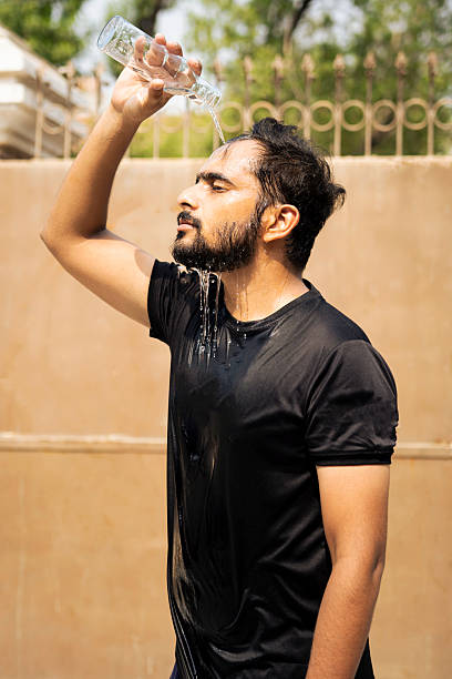 istock Man Cooling Down After Workout: Hydration and Fitness Routine 2222190971