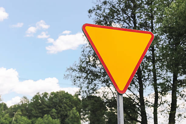 Transportation safety detail near trees and nature.