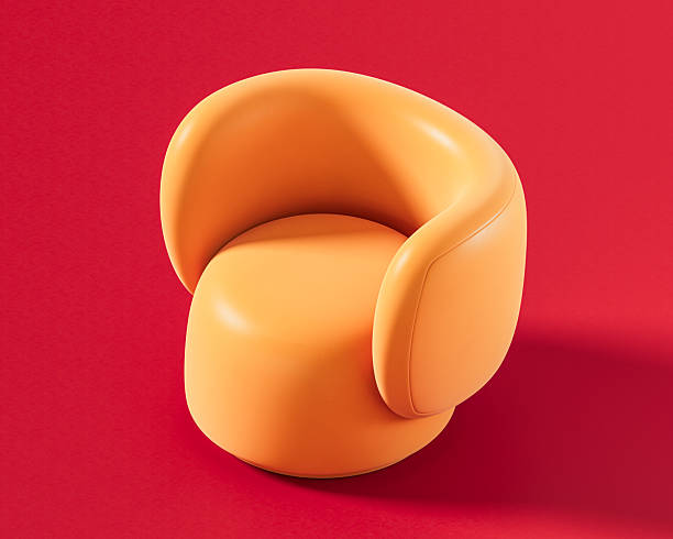 istock A unique orange round swivel chair with an enveloping, curved backrest, offering a modern and inviting design on a bold red background, 3d render 2222195055