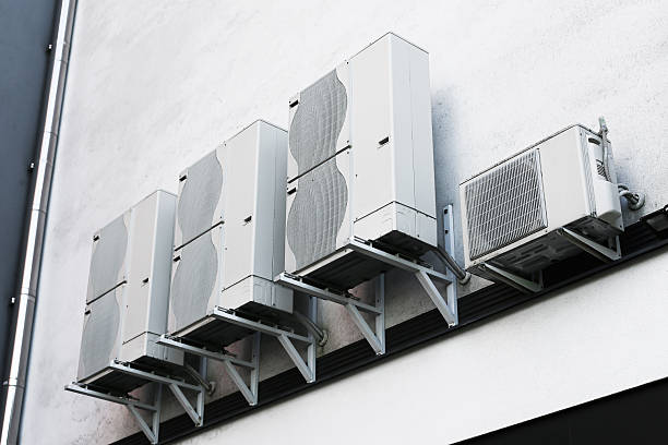istock Air conditioning units on modern building wall. Industrial HVAC system installed outdoors. Metal cooling devices for ventilation. 2222197785