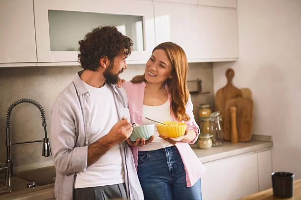 istock Happy couple enjoying breakfast together in modern kitchen 2222199606