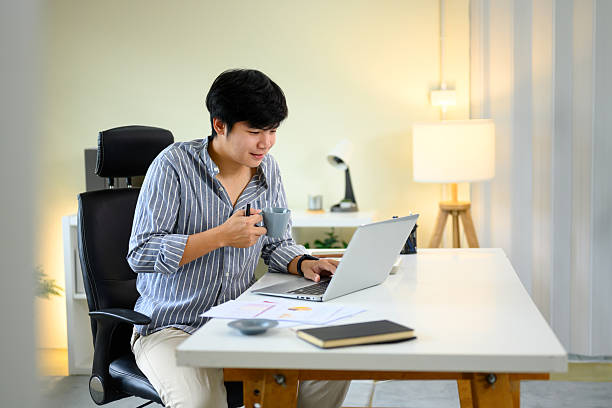 istock Relaxed remote worker enjoying a hot drink during a productive online work session 2222200405