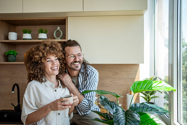 istock Happy couple enjoying morning coffee in modern kitchen 2222208352