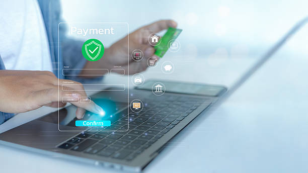 istock A person confirming an online payment using a credit card on a laptop. 2222208401