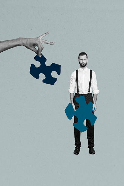 istock Vertical photo collage of serious businessman hold puzzle segment logic development hand hold other piece isolated on painted background 2222208656