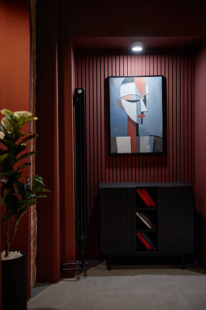 Abstract Painting Featuring Geometric Human Face Hanging on Wall in Modern Interior