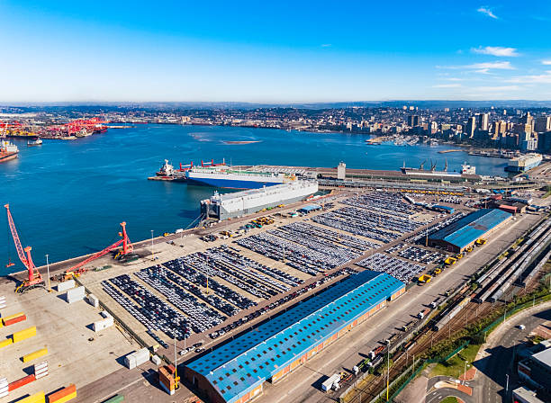 Durban Harbour, the largest and busiest shipping terminal in sub-Saharan Africa handling up to 31.4 million tons of cargo each year. Vehicles seen being exported.