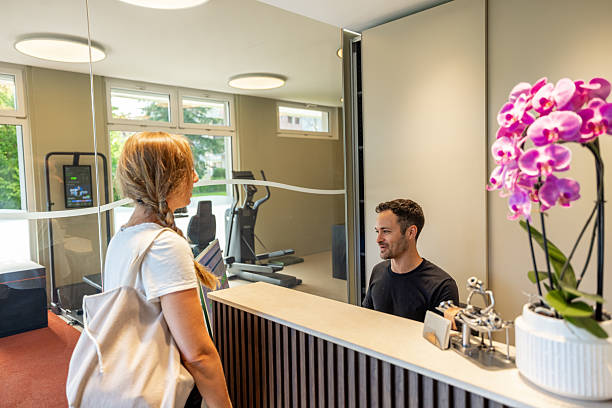 istock Woman Arriving at Physical Therapy Clinic Reception 2222212814
