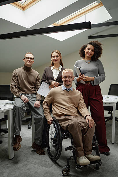 istock Diverse Young Adult Team Collaborating with Caucasian Man with Disability 2222214451