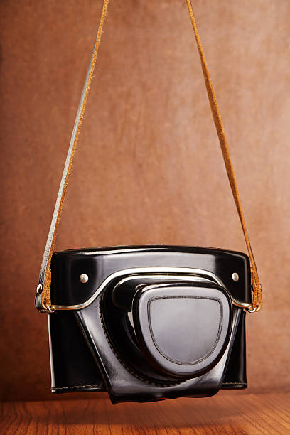 Analog vintage 35mm film camera in its leather case