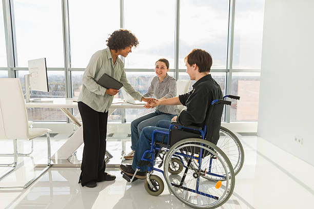 istock Stack of hands. Business startup teamwork unity concept. Top view of diverse multiracial business people putting hands together. Business colleagues during work process rejoice in success of company. 2222216856