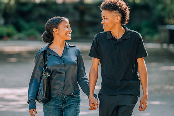 istock young romantic latin or hispanic couple walking outdoors arm in arm 2222217615