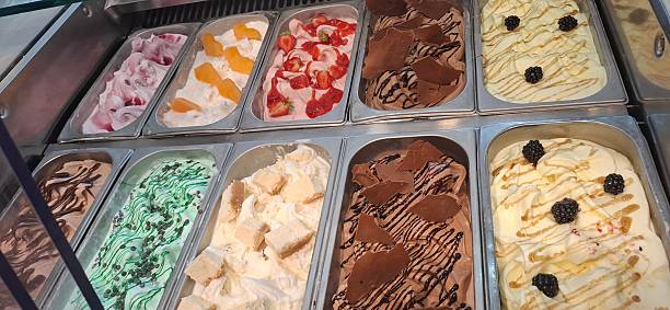istock Assorted Gourmet Ice Creams Displayed at a Gelato Counter With Various Toppings 2222217974