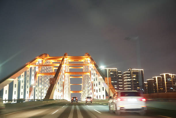 Speedy car drive on asphalt road steel bridge