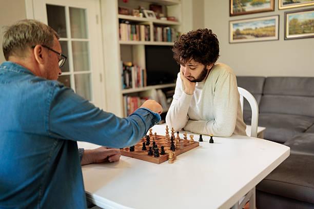 istock Father and son bonding over chess during a quiet Father's Day at home 2222221752