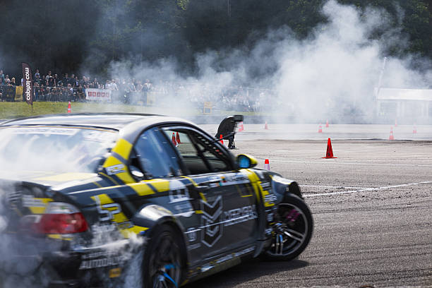 Race drift car burning tires on speed track
