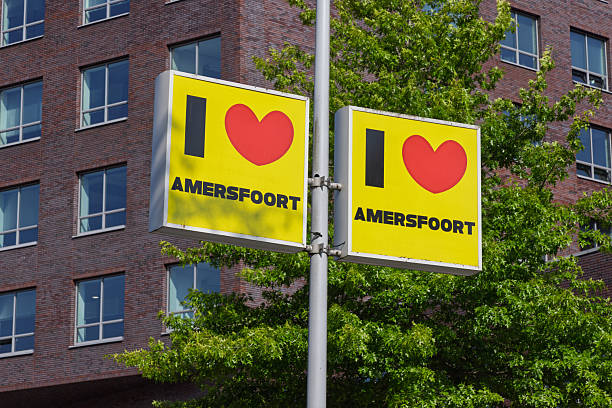 Urban street sign with bold yellow \
