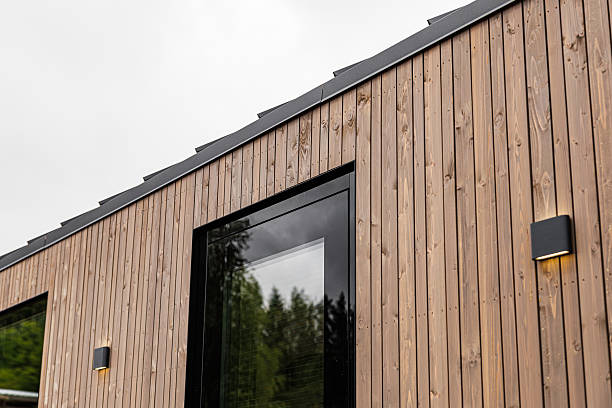 istock Modern Wooden House Facade With Black Window Trim 2222225174