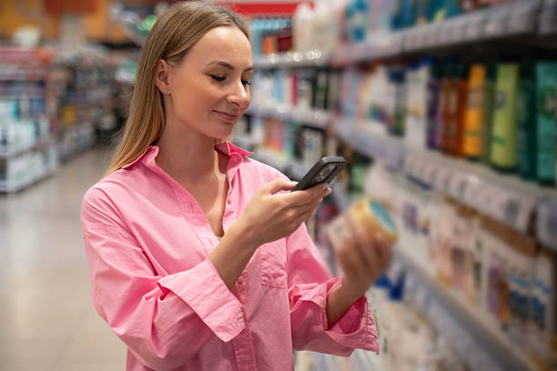 istock Customer scanning product barcode with smartphone in supermarket 2222225703