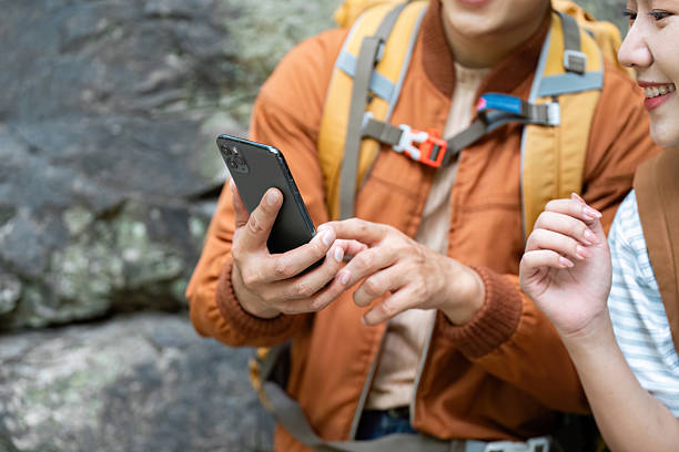 istock Travel Technology. Couple using smartphone while enjoying a hike in nature. 2222227786