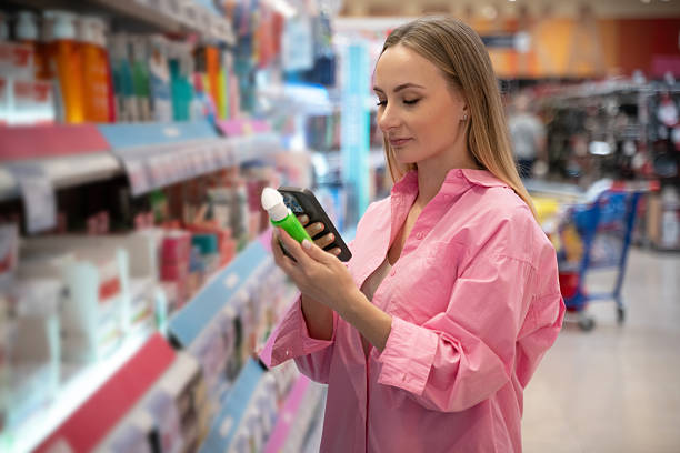 istock Customer using smartphone scanning product in supermarket 2222230555