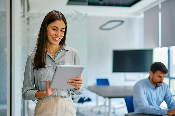 istock Young businesswoman using digital tablet in modern office 2222230696